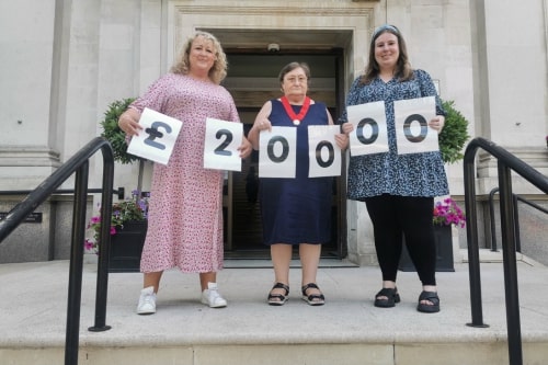 Former Islington Mayor Cllr Marian Spall presents a cheque to Whittington Health Charity
